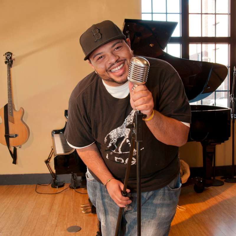 Corey DePina teaches rap and hip hop culture workshops for schools in Massachusetts